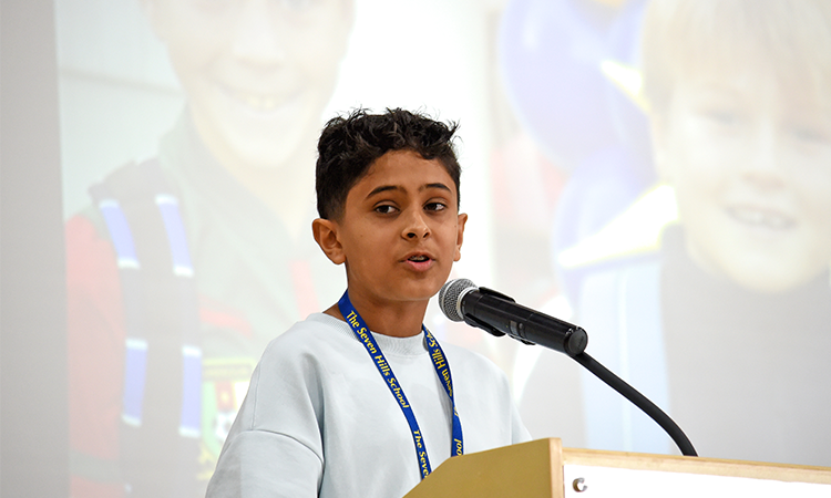 Eehaan Ashok speaks during the all-school assembly
