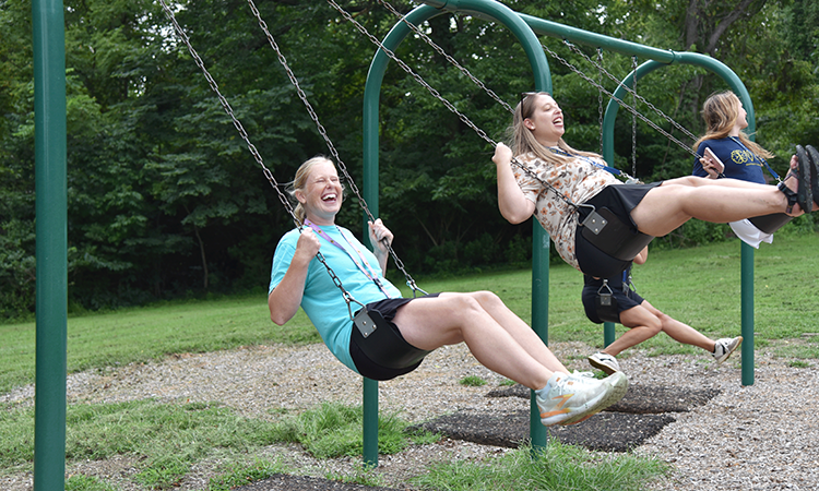 Faculty-and-Staff-at-French-Park_Swings Lotspeich faculty take their turn on the swings at French Park