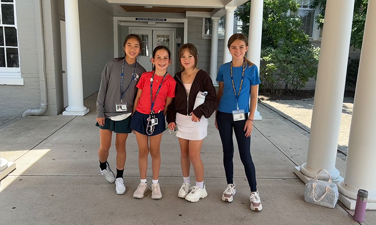 Middle Schoolers pose for a photo during lunch
