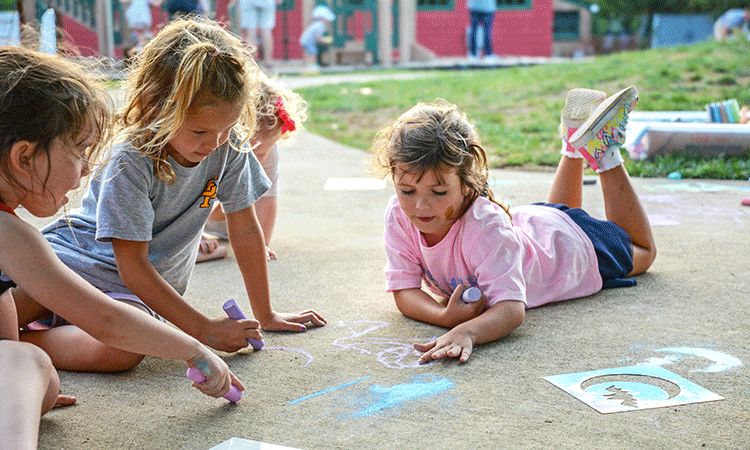 2026_Homecoming-Early-School-18-Doherty Students Early School students draw with chalk