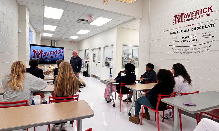 Big-E-Maverick-Chocolate-Tour Upper School students listen to a presentation from Maverick Chocolates
