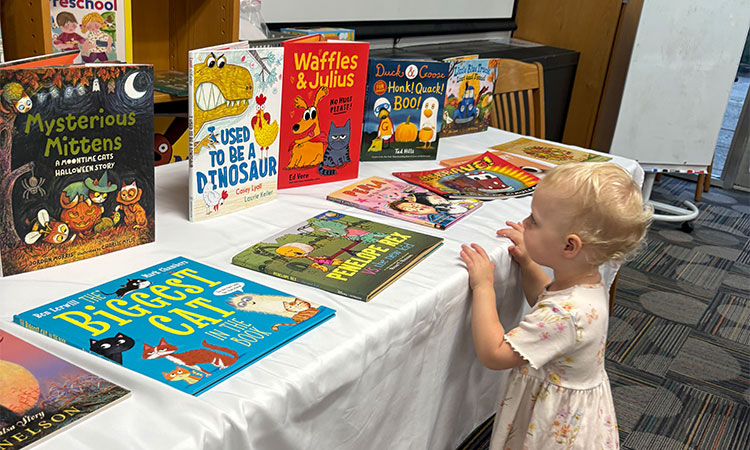 Doherty-Book-Fair---A-Student-Browses-Books A students browses books at the Lower School Book Fair