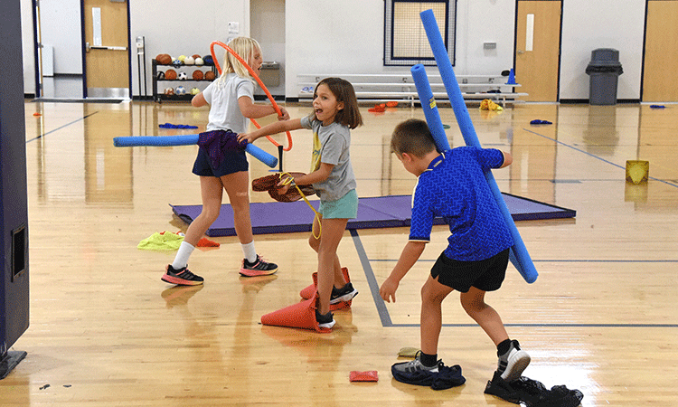Fourth grade PE Class Fourth graders play "cross the river" in PE class