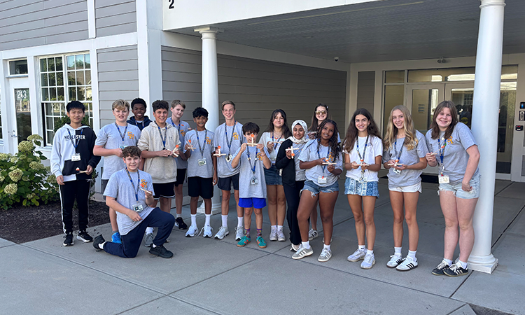 Latin-Class_Roman-Army_Cropped Eighth grade Latin students hold their homemade catapults