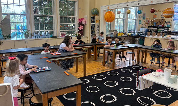 Pre-k-Enjoys-Science-Special Students sit at lab benches during their science special