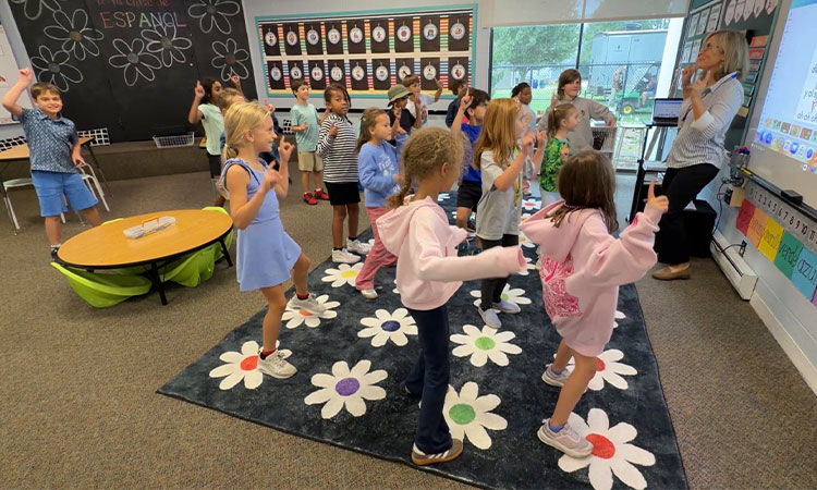 Second-grade-dances-to-a-song-in-Spanish Students dance during Spanish class