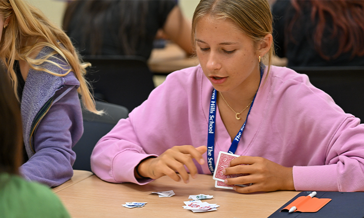 Students-playing-poker A student plays poker